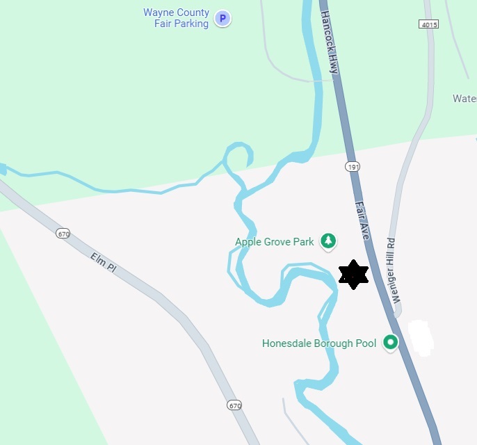 Located between the Pool Complex and the entrance to the Apple Grove Park.
